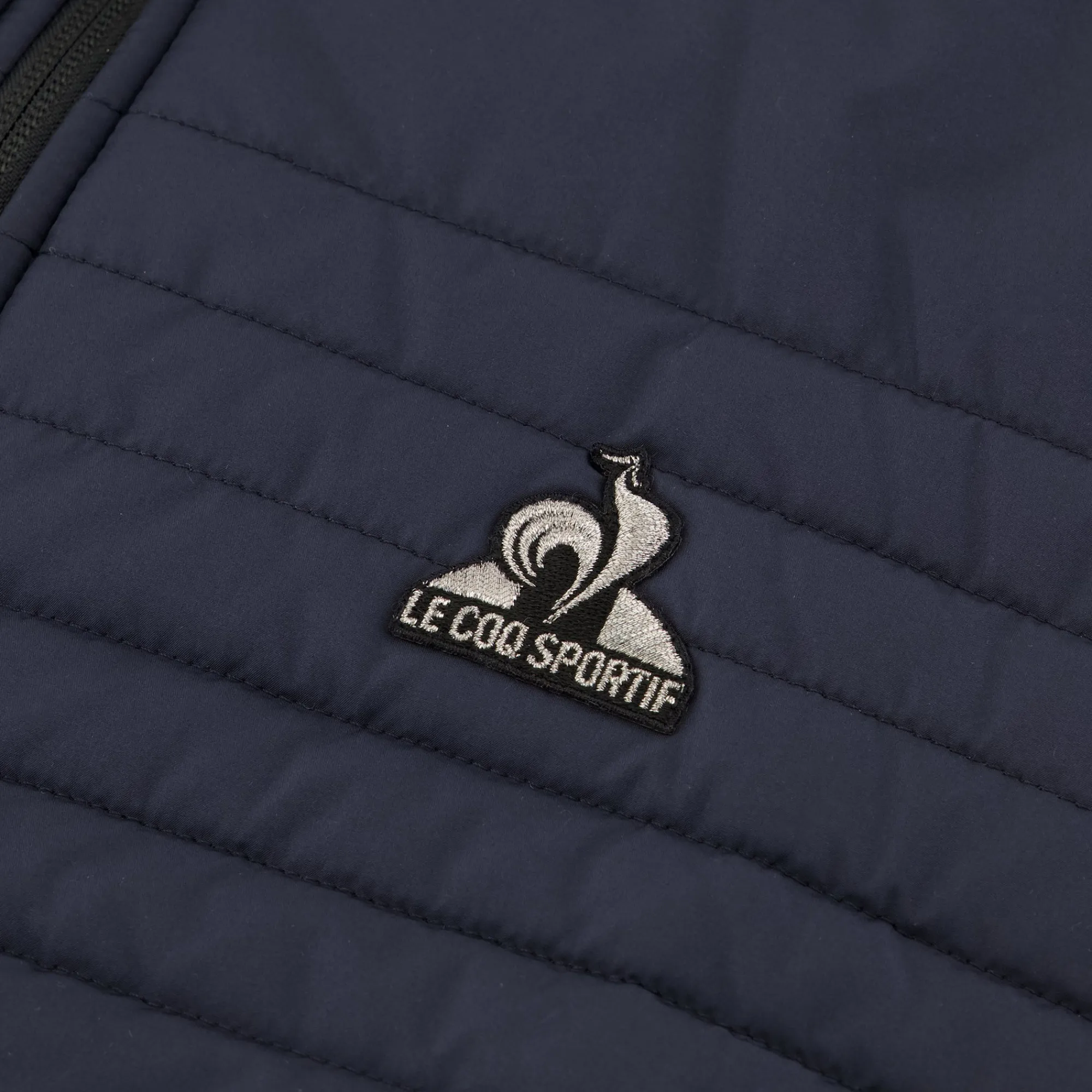 Le Coq Sportif Chaqueta de plumas sin mangas para hombre.-Hombre Chaquetas